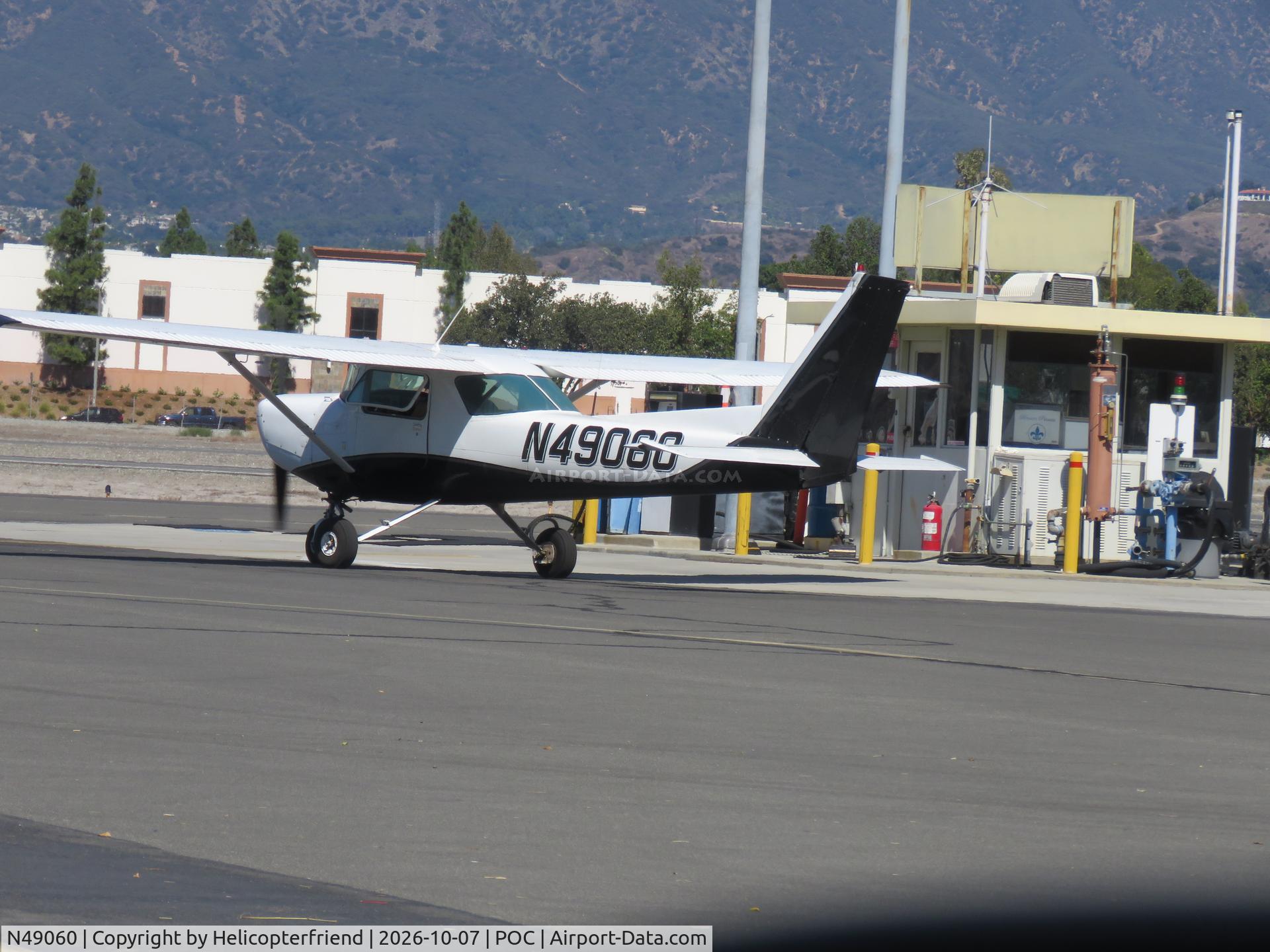 Aircraft N49060, 1979 Cessna 152, c/n 15283410, Pulling up to fuel pumps, at POC, photo by Helicopterfriend