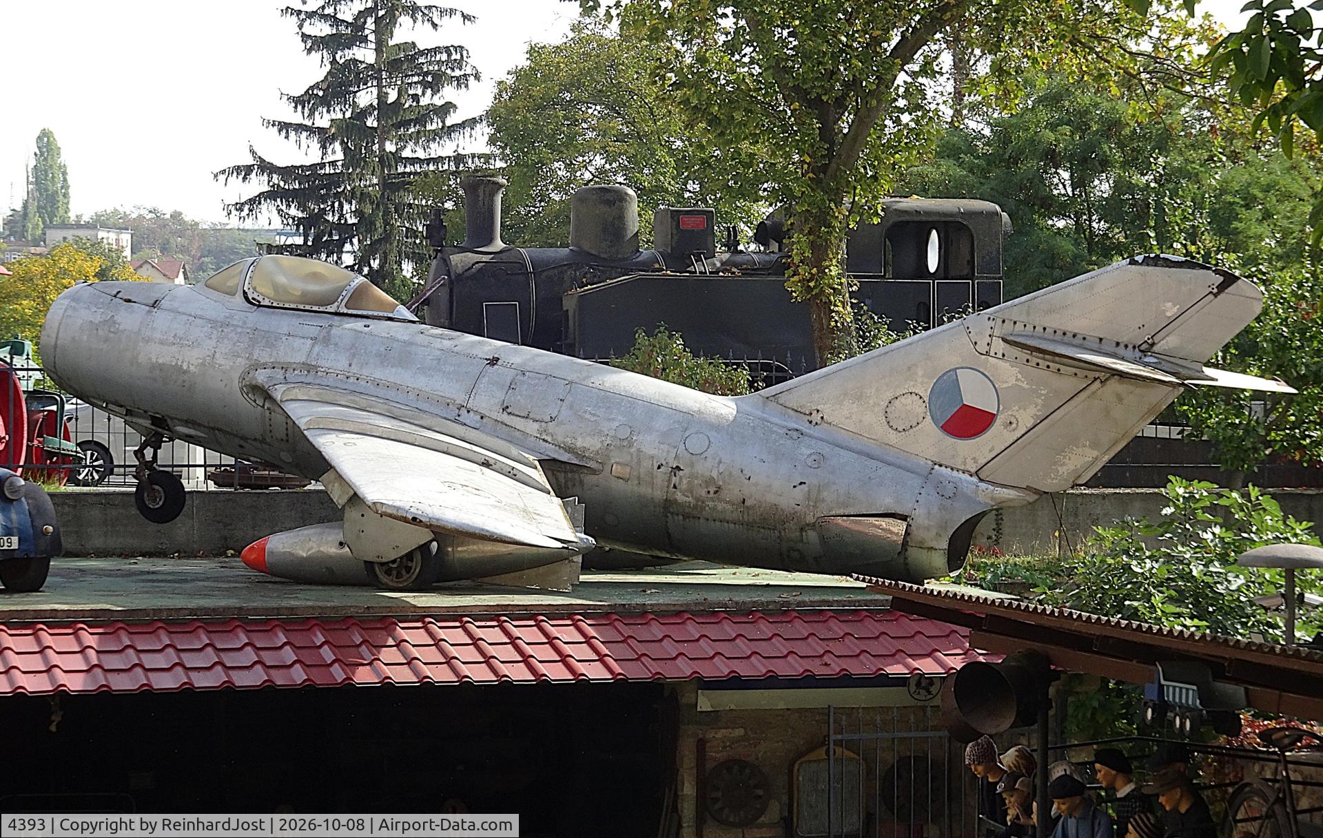 Aircraft 4393, With the fake Czech Air Force registration 4393 (originally it was 3934) on the right side this MiG can be found on the roof of the Muzeum motorismu Znojmo, Czech Republic, photo by ReinhardJost