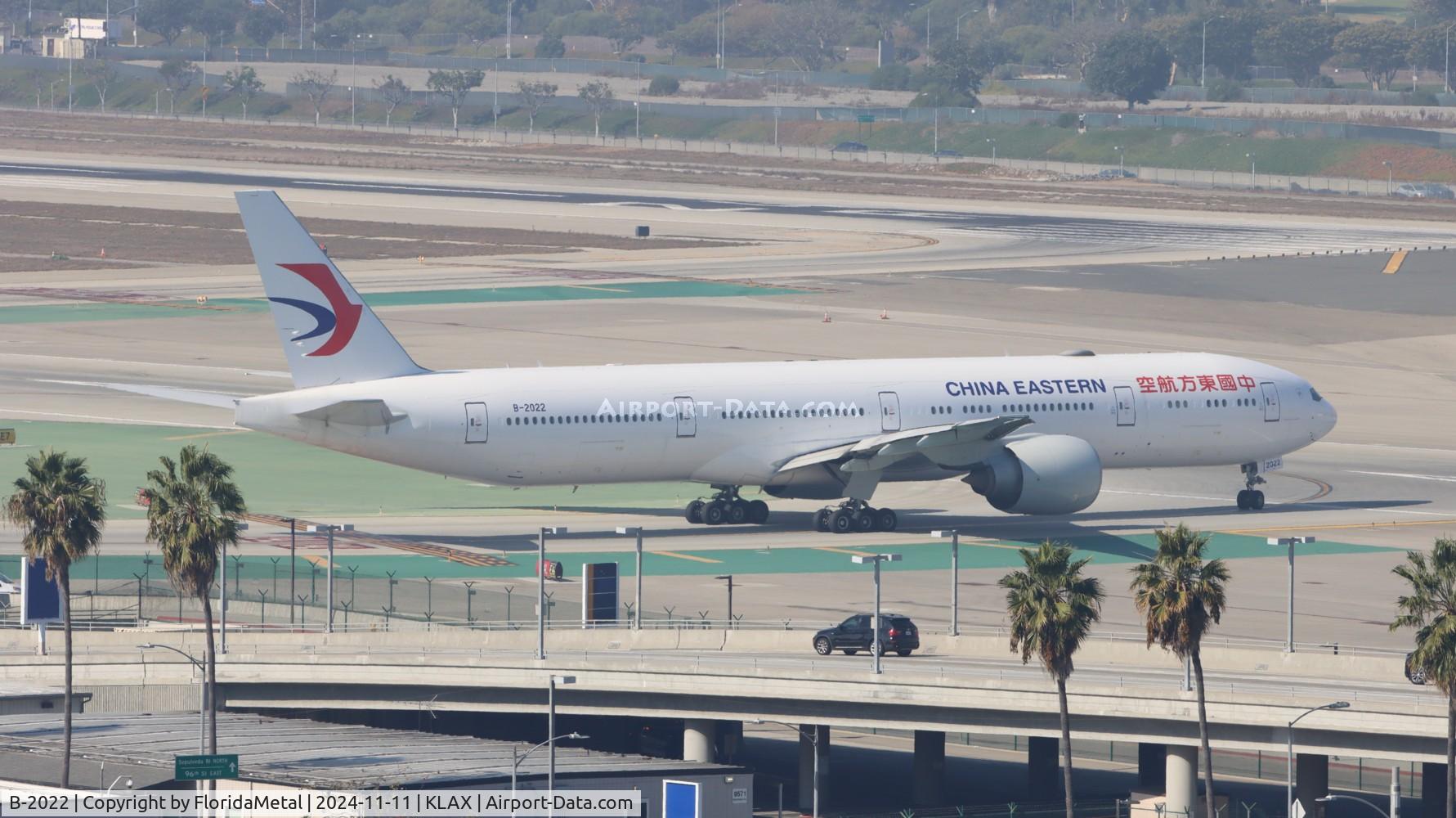Aircraft B-2022, 2015 Boeing 777-39P/ER, c/n 43274 l/n 1321, CES 773 zx lax-pvg, at KLAX, photo by FloridaMetal
