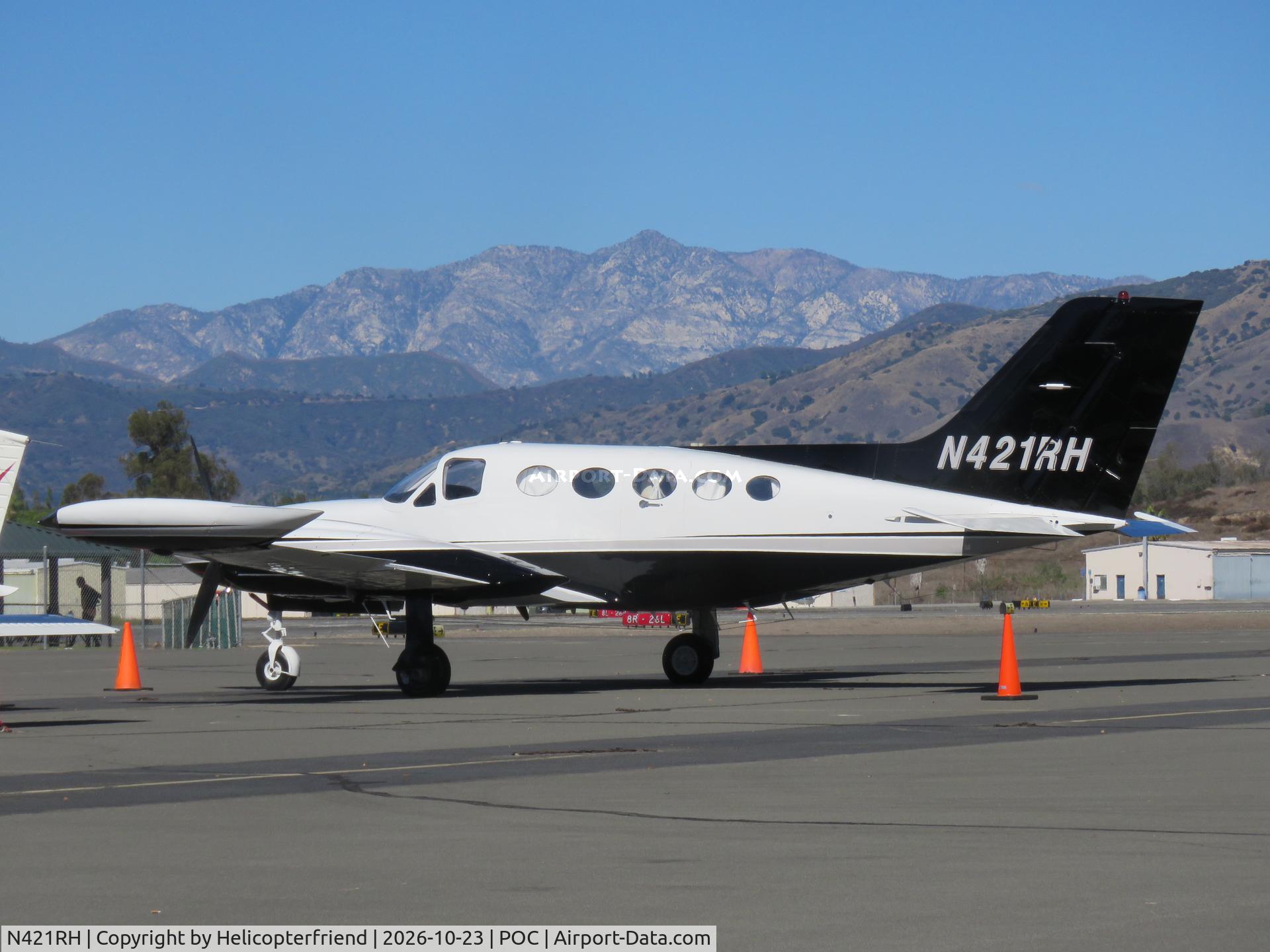 Aircraft N421RH, 1974 Cessna 421B Golden Eagle, c/n 421B-0605, Coned off and parked in transit parking, at POC, photo by Helicopterfriend