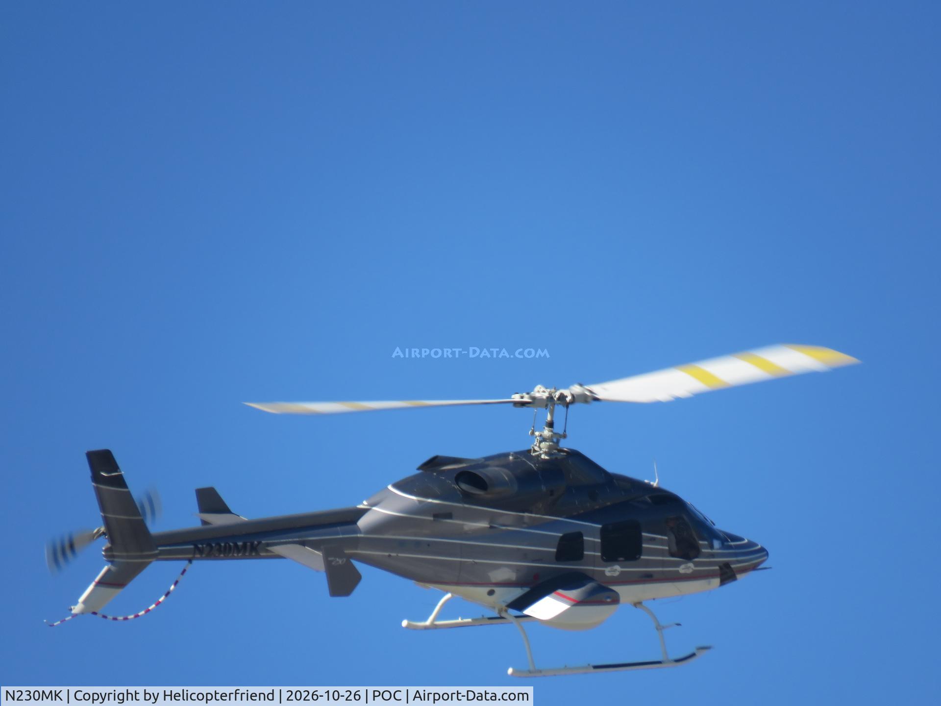 Aircraft N230MK, 1995 Bell 230, c/n 23035, Turning for a right downwind for landing south of taxiway Sierra, at POC, photo by Helicopterfriend