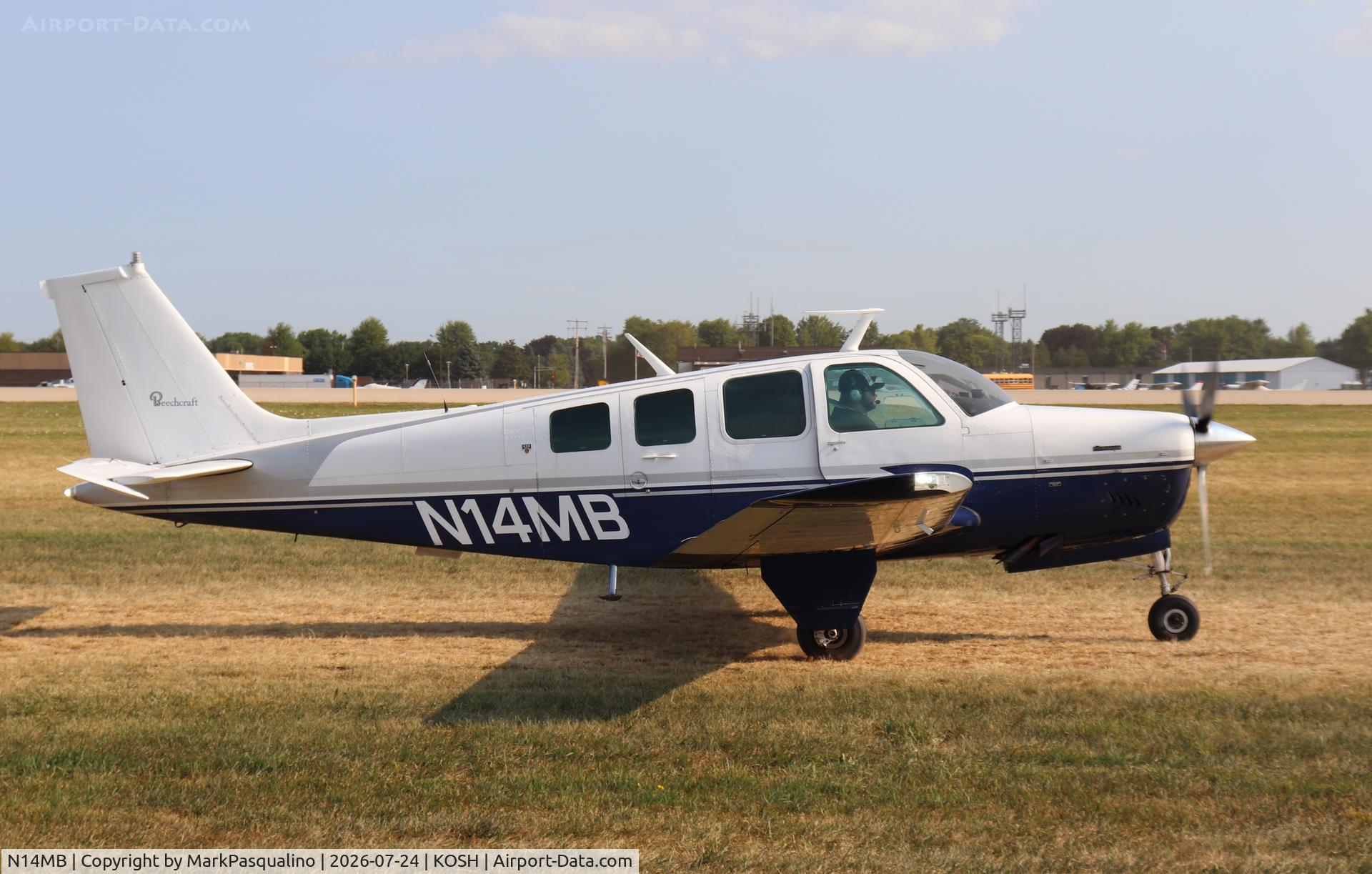 Aircraft N14MB, 1977 Beech A36 Bonanza 36, c/n E-1062, Beech A36, at KOSH, photo by MarkPasqualino