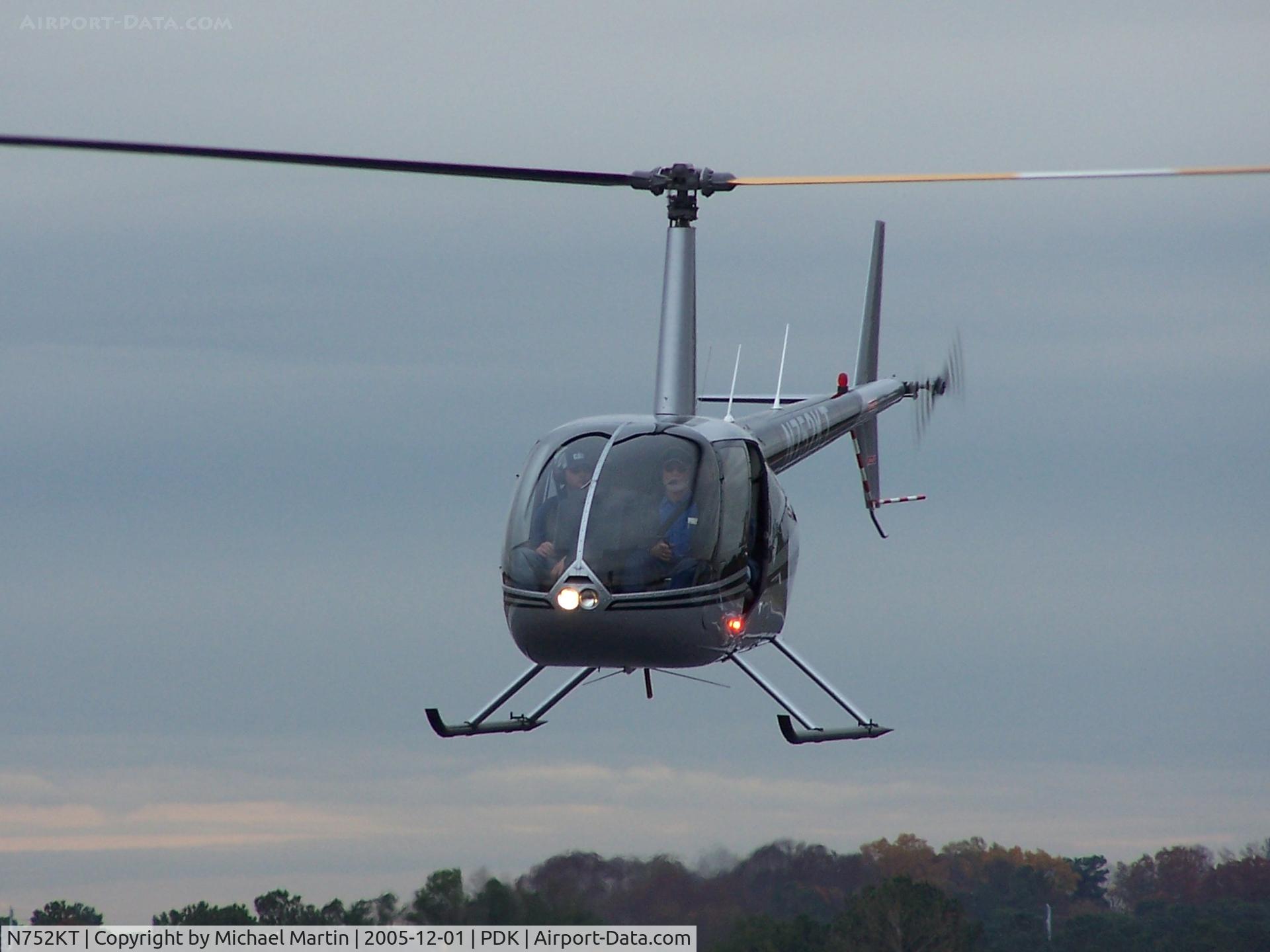 N752KT, 2006 Robinson R44 II C/N 11347, Helo getting ready to touch down at Mercury Air Center