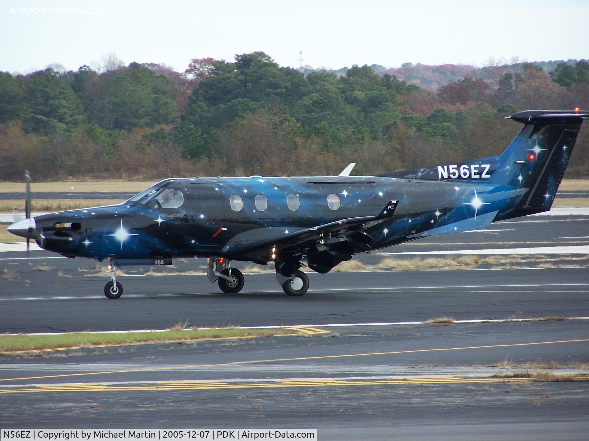 N56EZ, 2003 Pilatus PC-12/45 C/N 488, What a paint job!  Arriving at PDK.