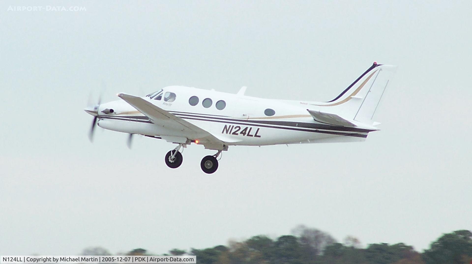N124LL, Raytheon Aircraft Company C90A C/N LJ-1695, Departing PDK - Starting to rotate gear.