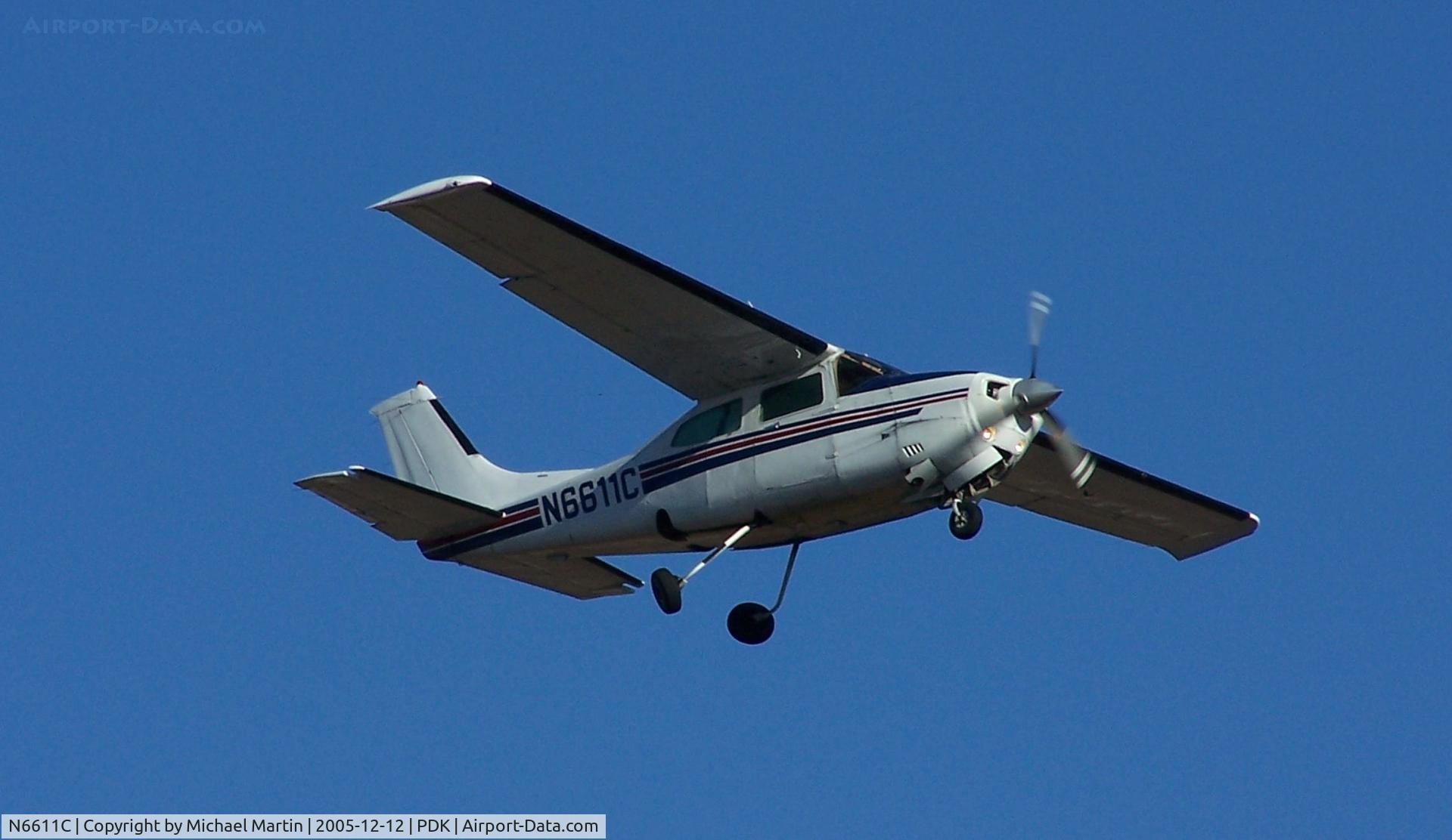 N6611C, 1980 Cessna T210N Turbo Centurion C/N 21063930, Over flying PDK