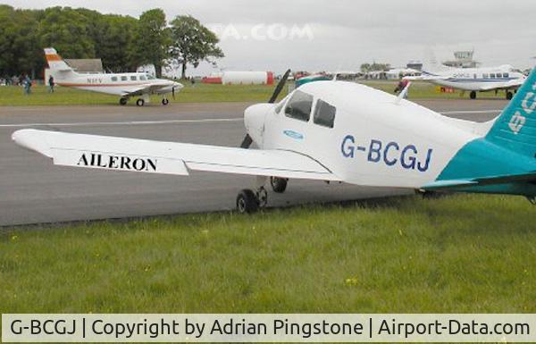 G-BCGJ, 1974 Piper PA-28-140 Cherokee Cruiser C/N 28-7425286, Aileron location on a Piper PA-28 Cherokee at the Great Vintage Fly-in Weekend, Kemble Airfield, England, May 2003. The aileron in the picture is slightly drooped.