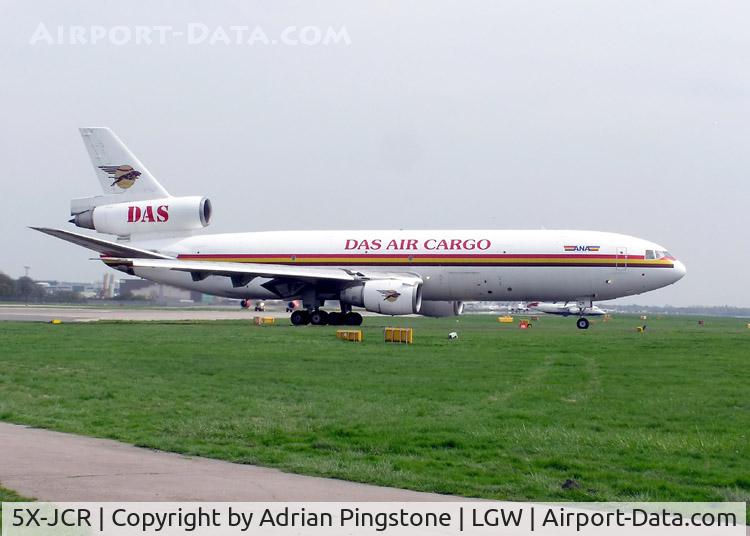 5X-JCR, 1980 McDonnell Douglas DC-10-30F C/N 47831, DAS Air Cargo DC-10-30 (5X-JCR) waiting for permission to take off at Gatwick Airport, England in July 2004