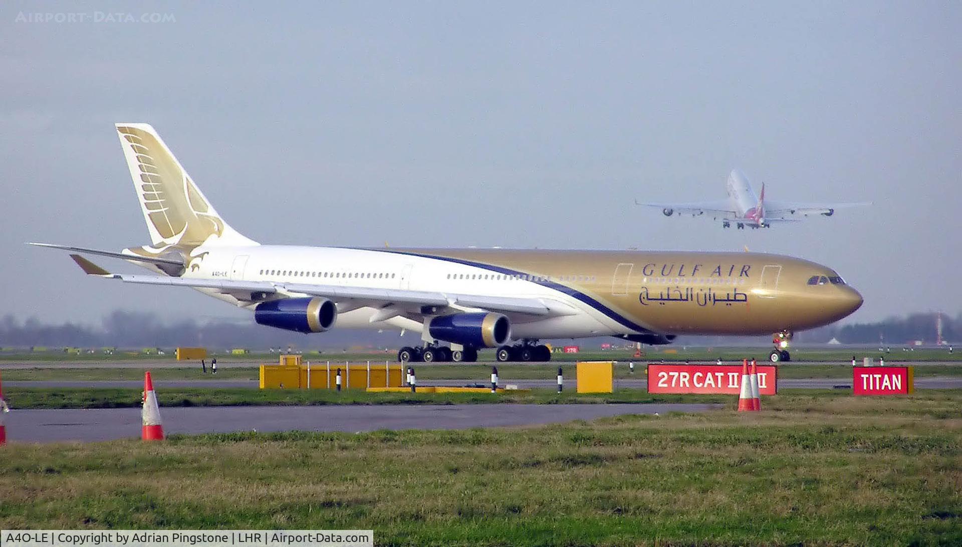A4O-LE, 1995 Airbus A340-312 C/N 103, Gulf Air Airbus A340-300 (A4O-LE) taxiing at London (Heathrow) Airport. A Virgin Atlantic Boeing 747 takes off over the top. Jan 2005