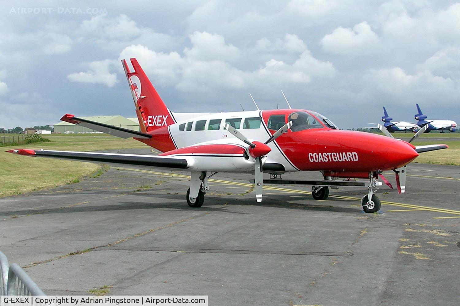 G-EXEX, 1977 Cessna 404 Titan C/N 404-0037, 1977 Cessna 404 Titan II (G-EXEX) at Kemble airfield, Gloucestershire, England. Operated by Atlantic Reconnaissance, a part of Air Atlantic. Note the long radar underneath to assist detection of sea pollution.