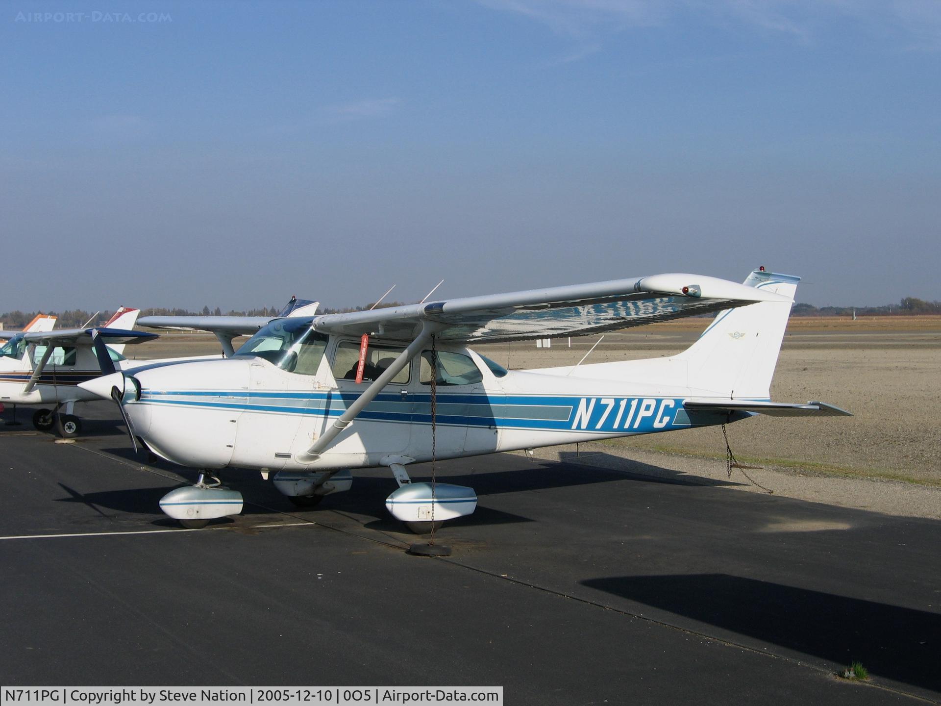 N711PG, Cessna 172M C/N 17264422, Cal Aggie Flying Farmers 1983 Cessna 172M in December sun at University Airport (Davis), CA