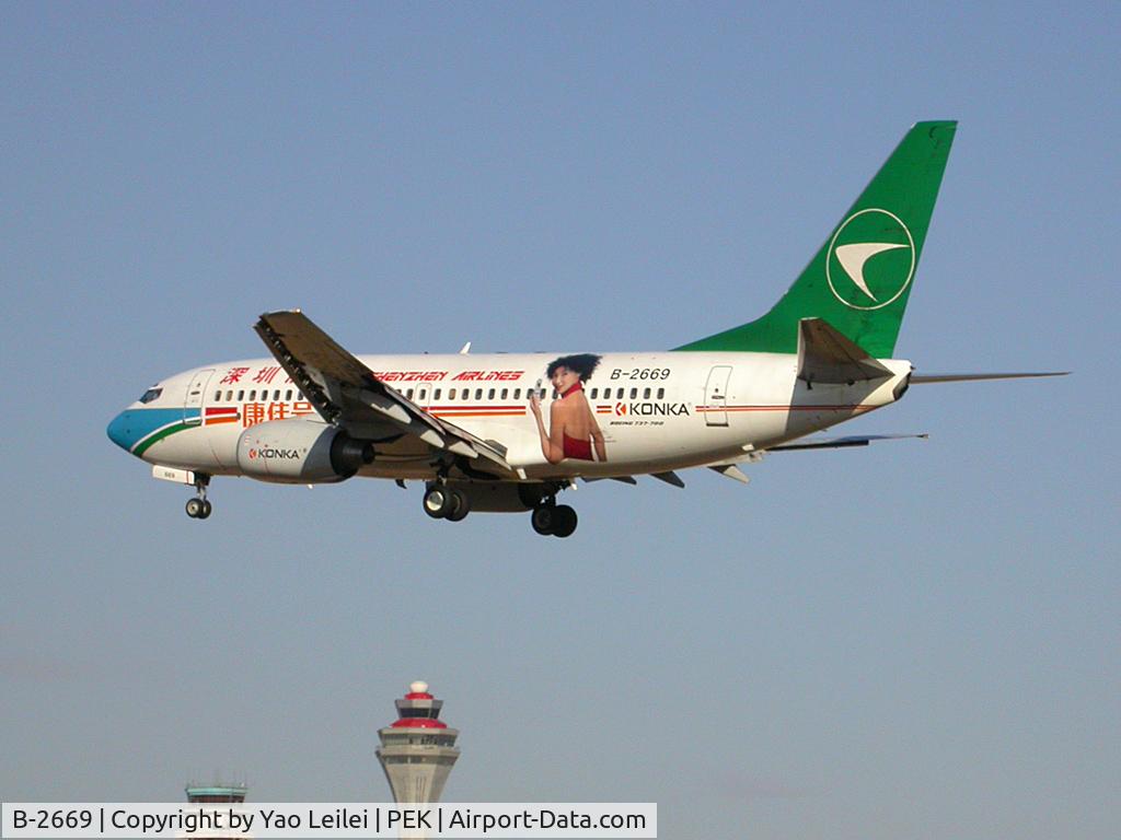 B-2669, 2001 Boeing 737-77L C/N 32722, Shenzhen Airlines' Boeing 737 in Beijing. With Maggie Cheung painted on the body to advocate Konka.