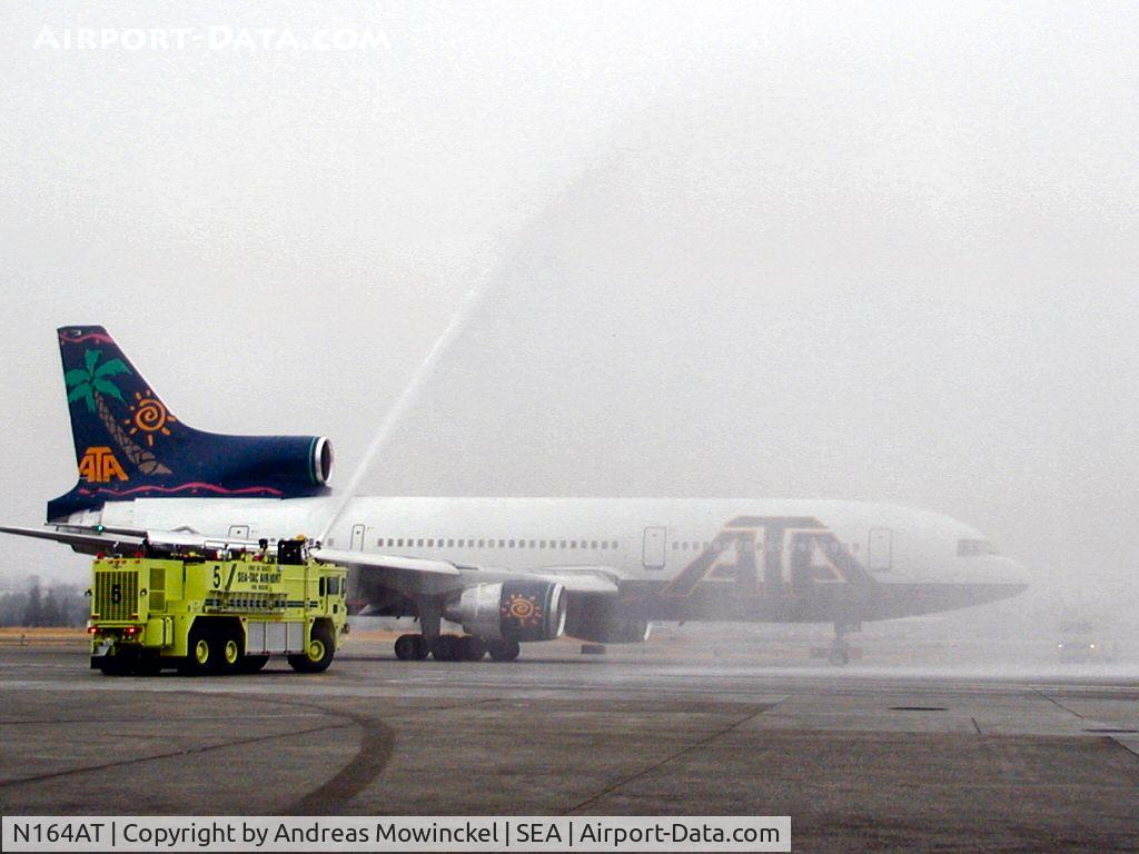 N164AT, 1982 Lockheed L-1011-385-3 TriStar 500 C/N 293A-1238, ATA Airlines Lockheed L-1011 at Seattle-Tacoma International Airport. Captain Jim gets a hosedown to celebrate his last flight