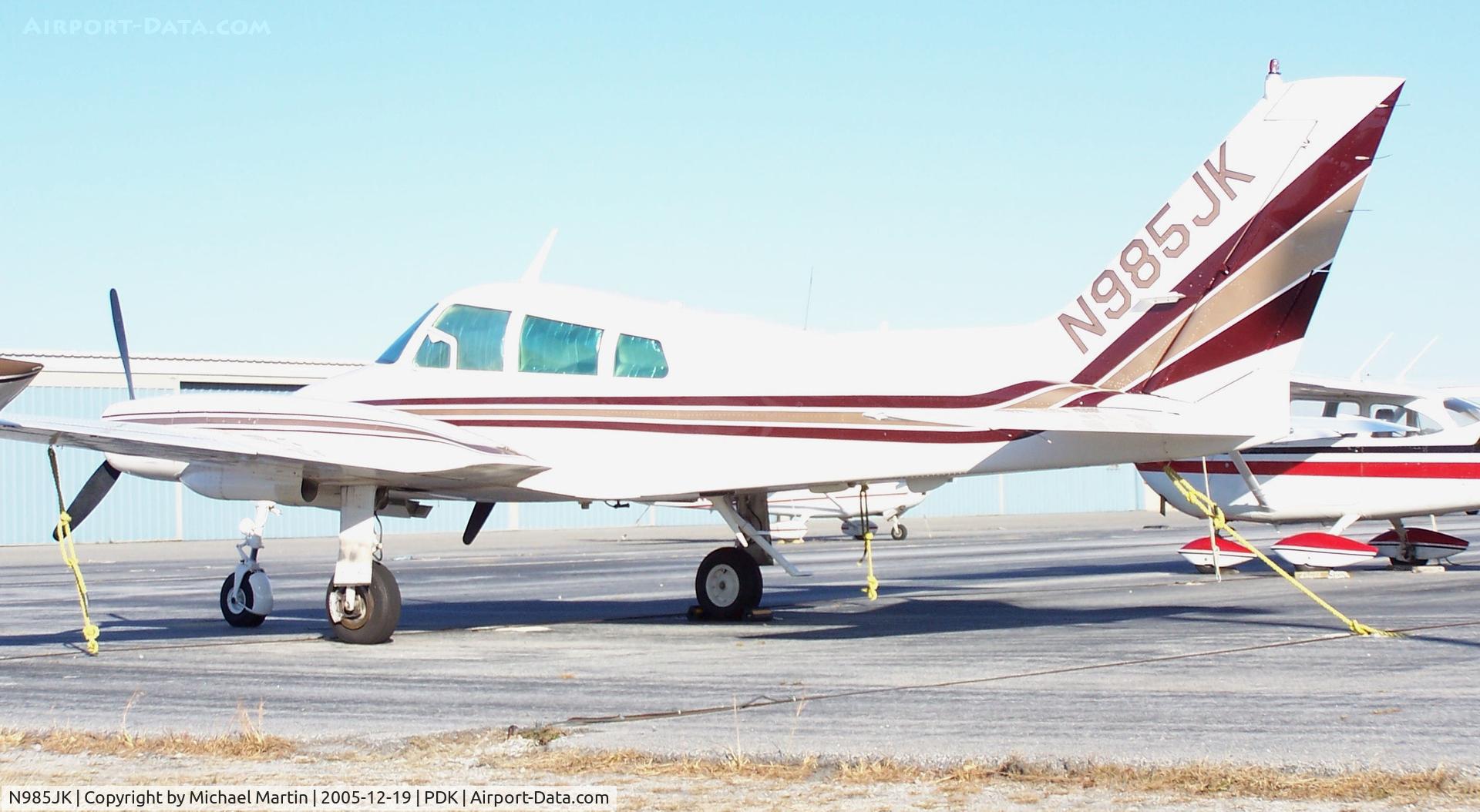 N985JK, 1964 Cessna 310I C/N 310I0012, Tied down @ PDK