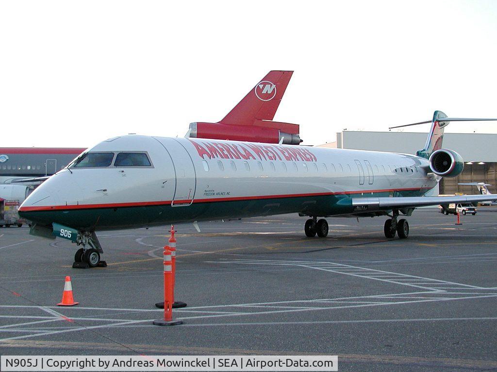 N905J, 2003 Bombardier CRJ-900 (CL-600-2D24) C/N 15005, Freedom Air CRJ-900 at Seattle-Tacoma International Airport.