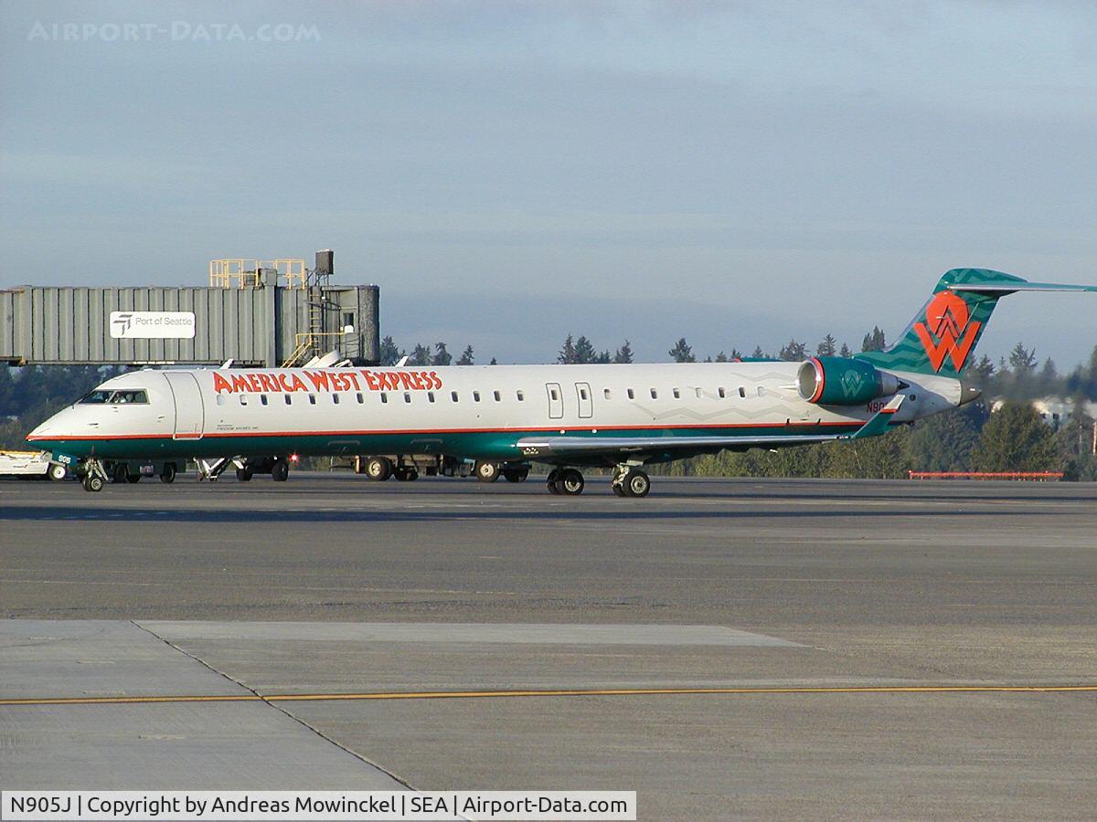 N905J, 2003 Bombardier CRJ-900 (CL-600-2D24) C/N 15005, Freedom Air CRJ-900 at Seattle-Tacoma International Airport.