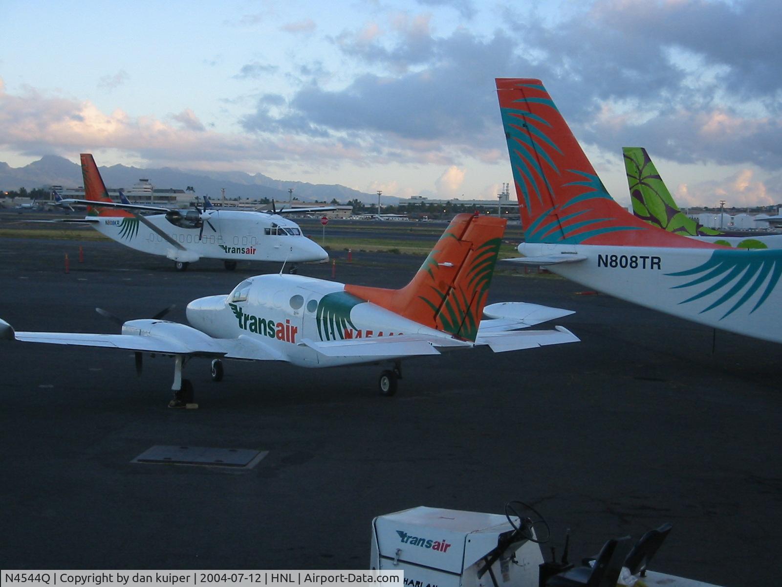 N4544Q, 1969 Cessna 402A C/N 402A0044, after a hard night of work, back on the south ramp HNL.
