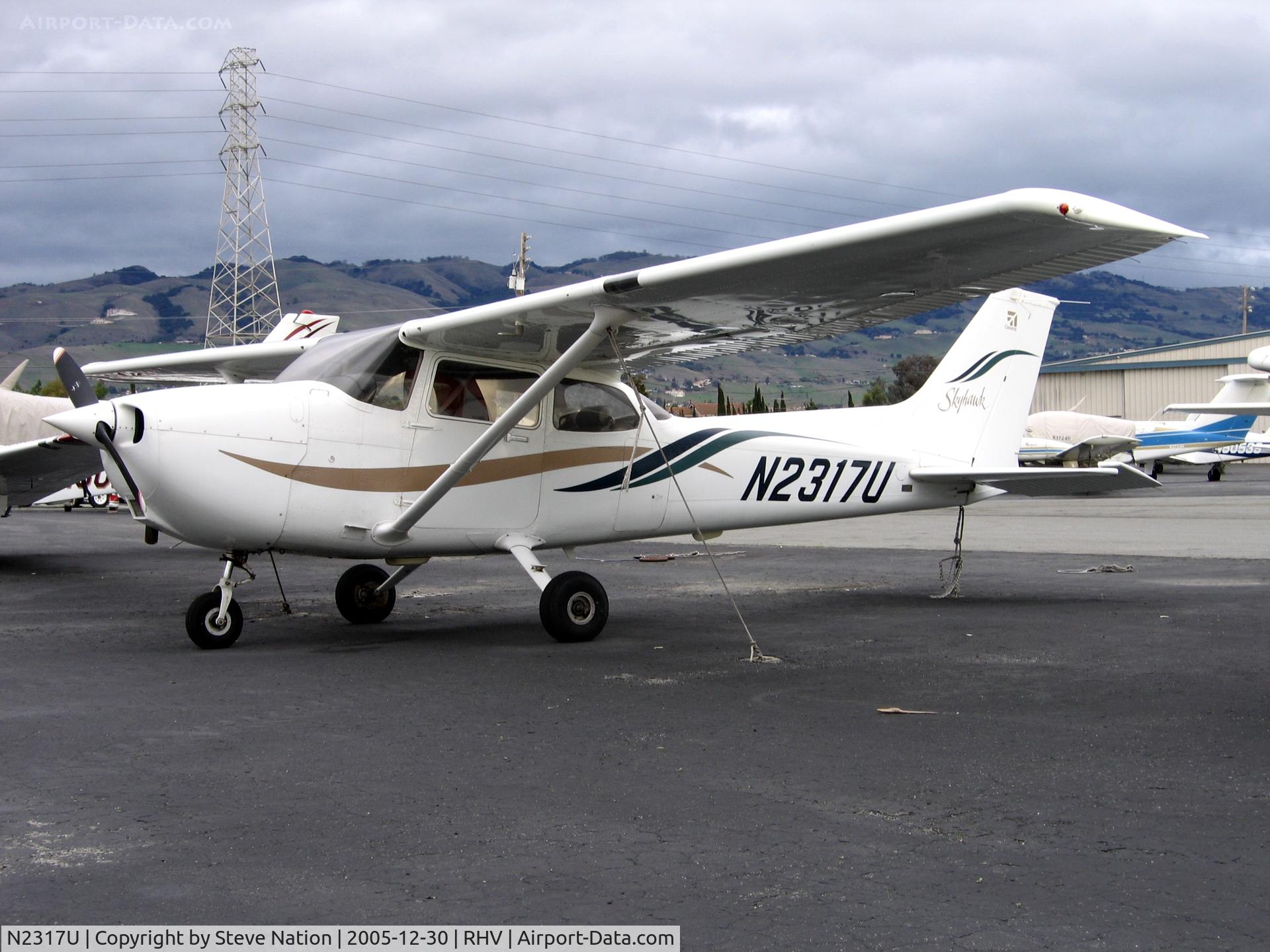 N2317U, 1999 Cessna 172R C/N 17280695, Blackbird Services 1999 Cessna 172R between rainstorms at Reid-Hillview Airport, San Jose, CA