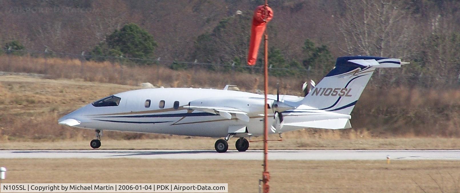 N105SL, 2003 Piaggio P-180 C/N 1068, Hate it when the windsock get's in the way of the picture!