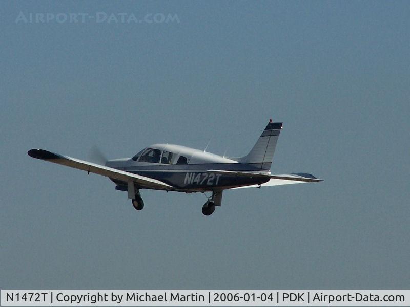 N1472T, 1972 Piper PA-28R-200 C/N 28R-7235298, Departing PDK - Starting to rotate gear.