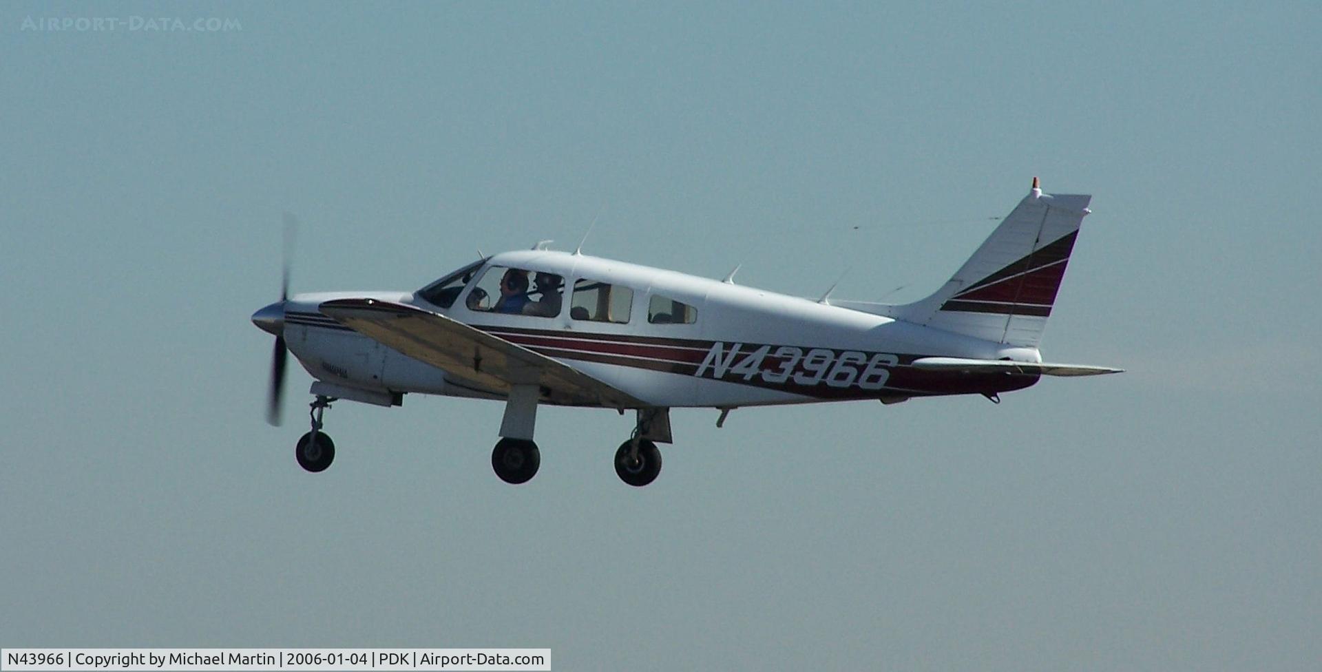 N43966, Piper PA-28R-201 Cherokee Arrow III C/N 28R-7737139, Departing PDK - Starting to rotate gear.