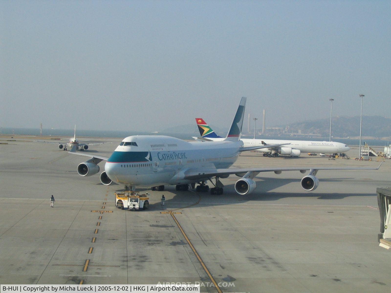 B-HUI, 1994 Boeing 747-467 C/N 27230, Push-back at Hong Kong