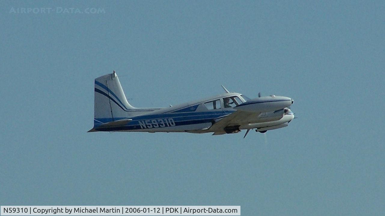 N59310, 1959 Cessna 310C C/N 39007, Departing PDK on 20L