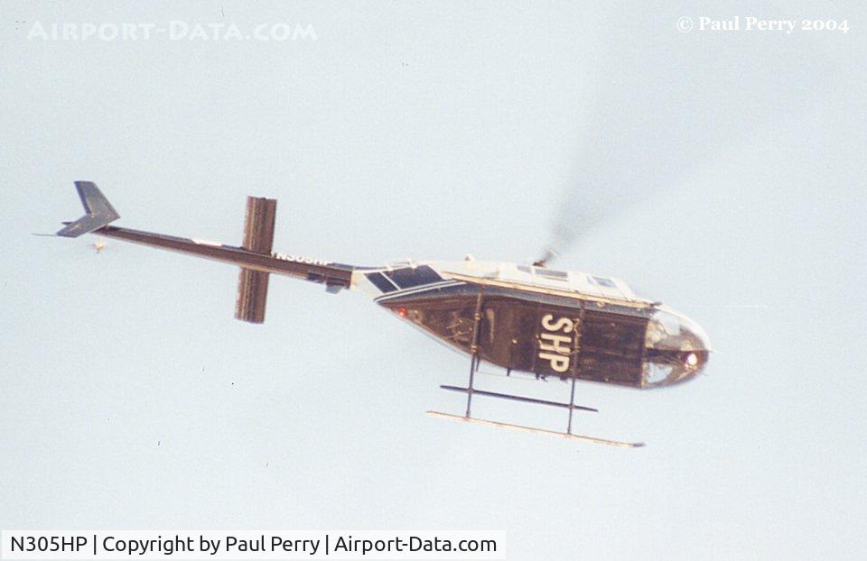 N305HP, Bell OH-58A Kiowa C/N 41651, NC Highway Patrol zooming over Ahoskie, NC