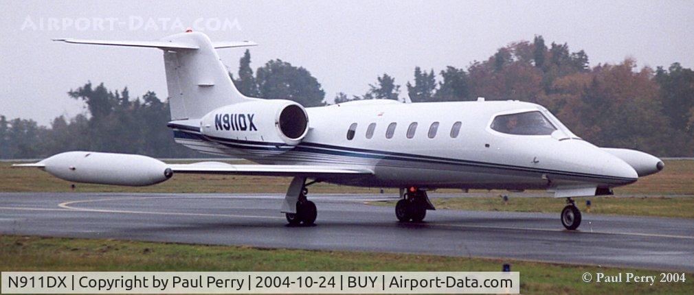 N911DX, 1983 Gates Learjet 35A C/N 499, Making her way to the ramp on a rainy day.
