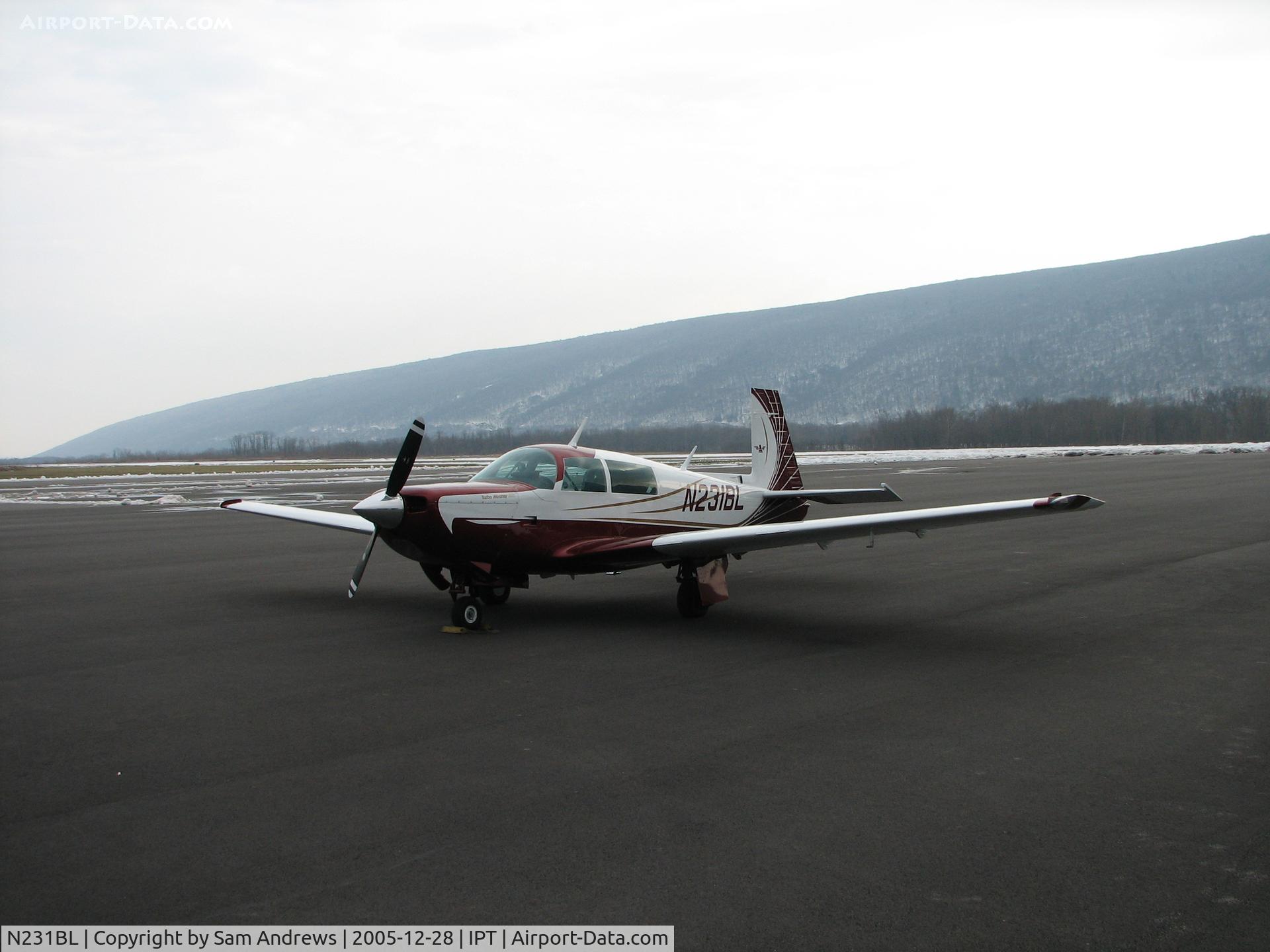 N231BL, 1979 Mooney M20K C/N 25-0117, Sitting on the ramp at IPT.  Bald Eagle mountain in the distance