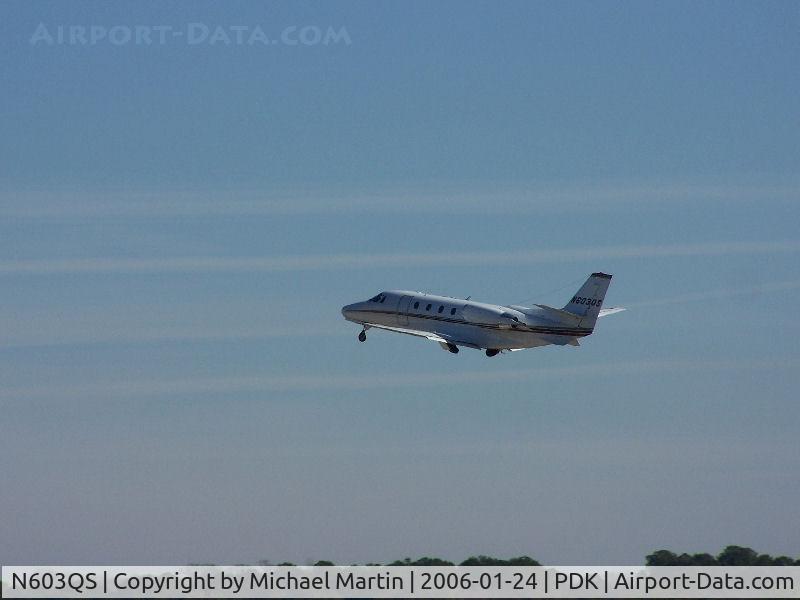 N603QS, 2001 Cessna 560XL Citation Excel C/N 560-5203, Departing PDK - Starting to rotate gear.