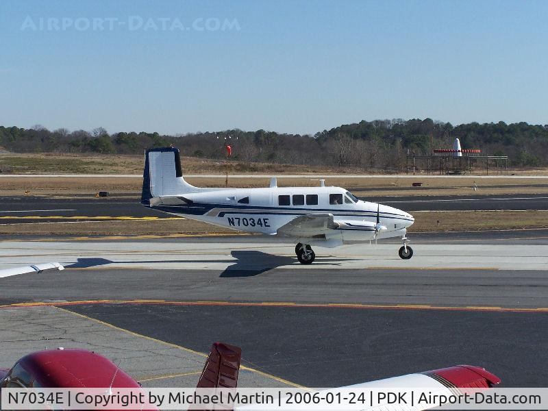 N7034E, 1962 Beech 65 (LF-23F) C/N LF-49, Taxing to Mercury Air Center