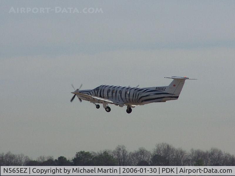 N565EZ, 1999 Pilatus PC-12/45 C/N 290, Stripes and all!  Departing 2L.