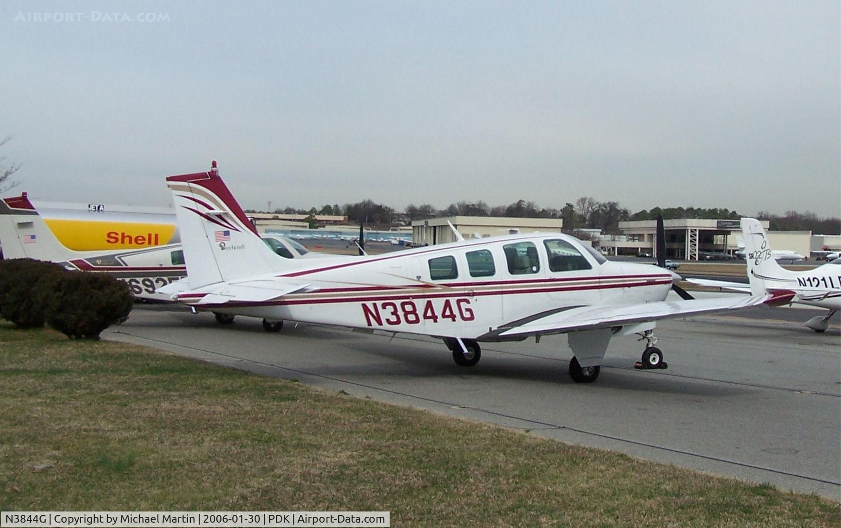 N3844G, 1981 Beech A36 Bonanza 36 C/N E-1826, Tied down @ PDK with vairous AC in background