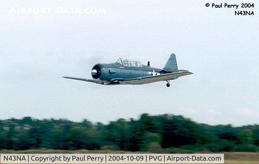 N43NA, 1943 North American SNJ-4 Texan C/N 88-11798, One of the Fighter Factory's SNJs buzzes PVG's runway