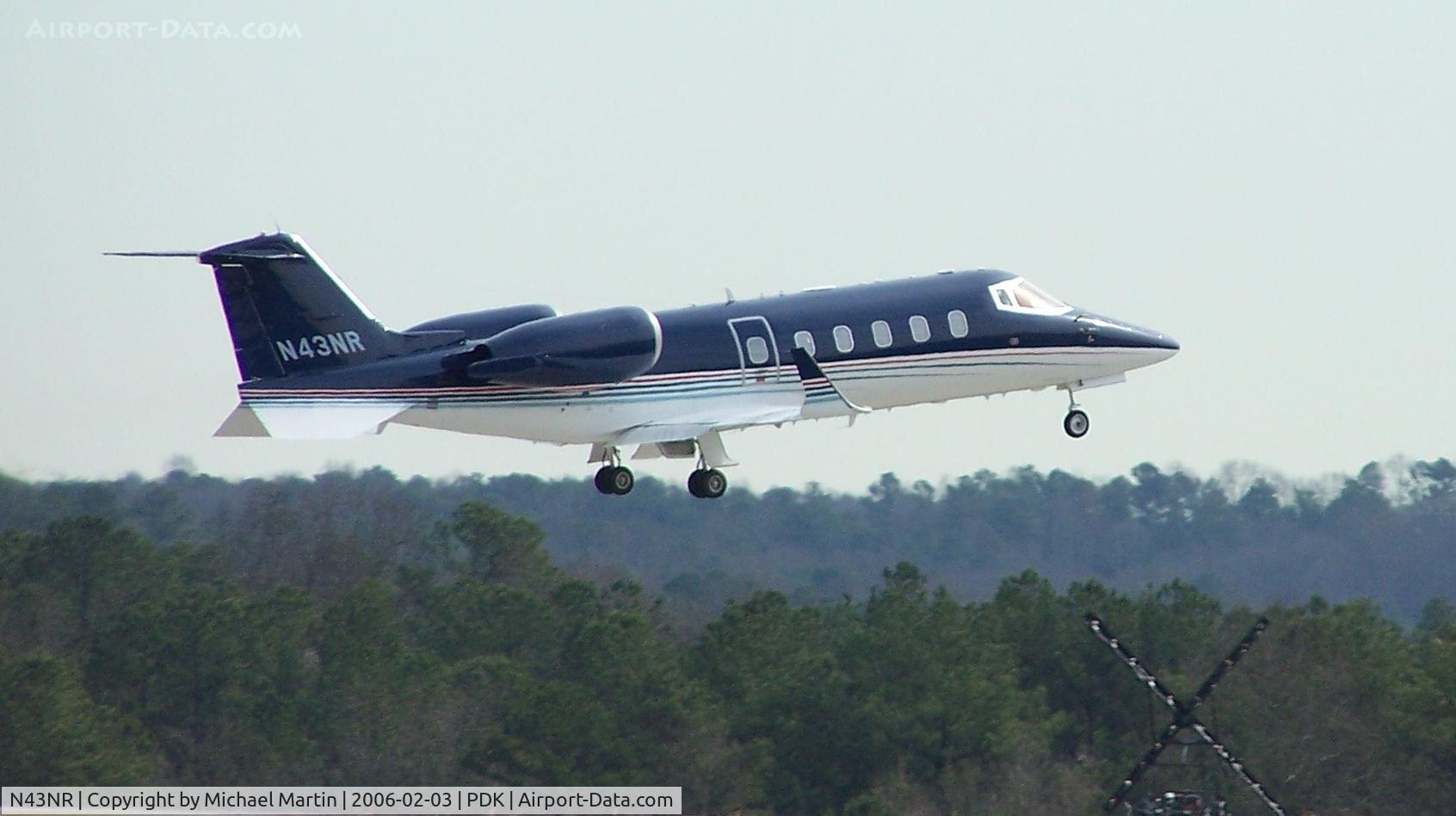 N43NR, 1994 Learjet 60 C/N 043, Departing PDK - Starting to rotate gear.