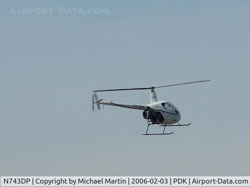 N743DP, 2003 Robinson R22 BETA C/N 3429, Helo overhead airport.