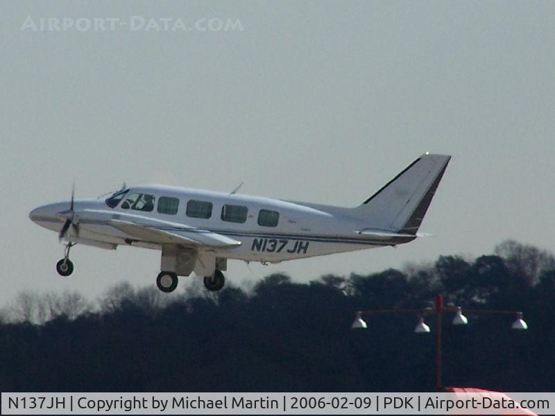 N137JH, 1981 Piper PA-31-350 Chieftain C/N 31-8252025, Departing PDK - Starting to rotate gear.