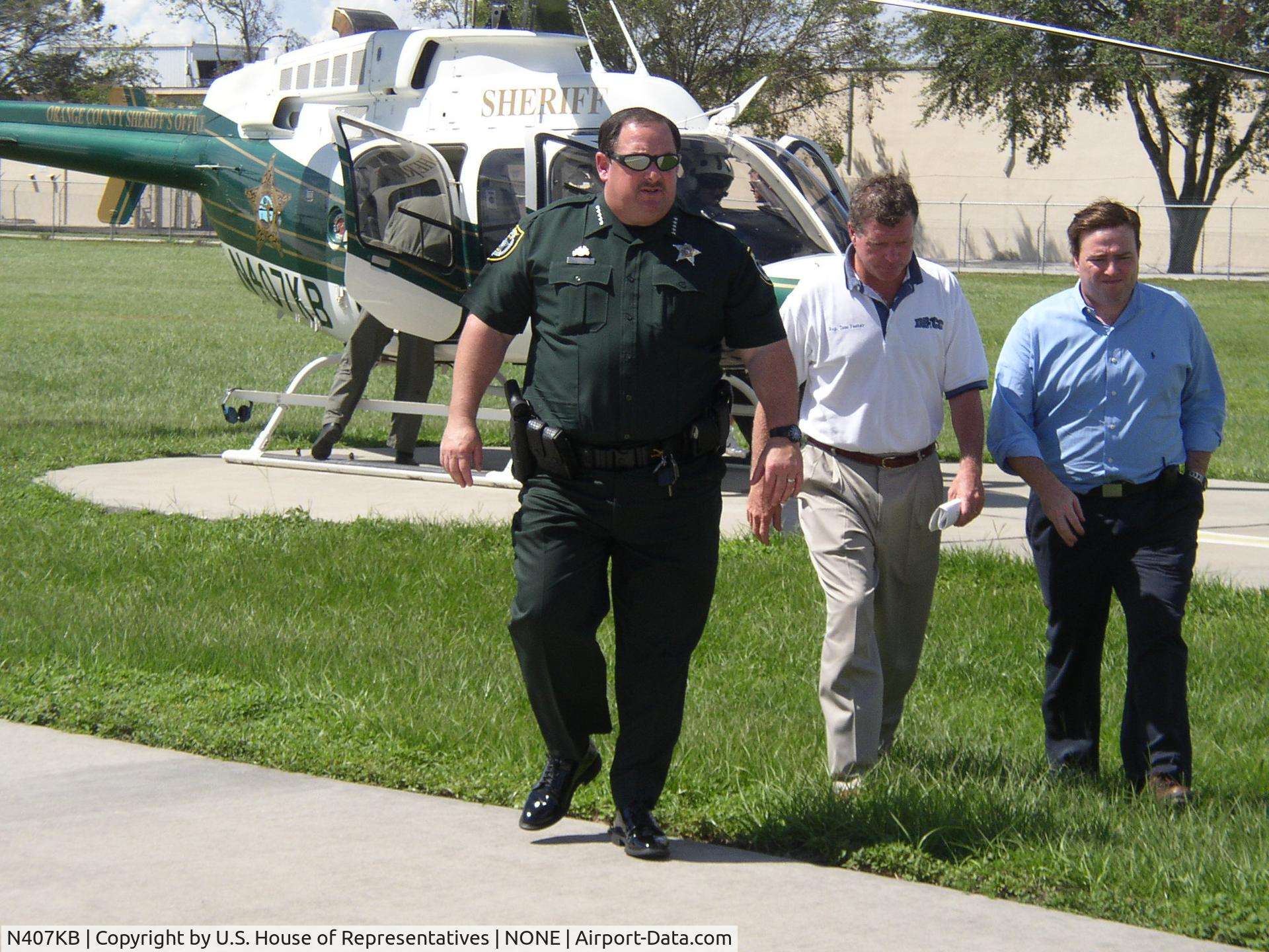 N407KB, 1997 Bell 407 C/N 53146, Congressman Feeney, Sheriff Beary and Congressman Keller after touring areas damaged by Hurricanes Charley and Frances. This image is a work of a U.S. House of Representatives employee, taken or made during the course of an employee's official duties. As