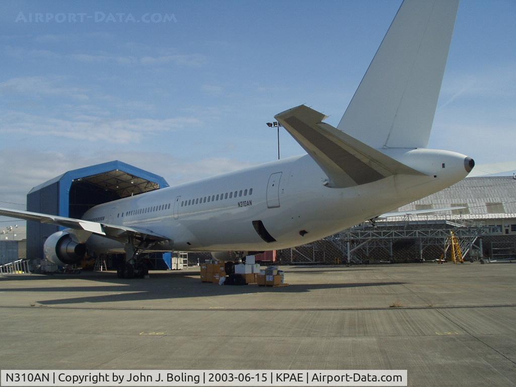 N310AN, 1994 Boeing 767-33A/ER C/N 27310, Loading for ferry from KPAE to CYUL. Boxes being loaded in aft cargo bay are aircraft logs and records - 1200 lbs. Pilots Bruce Burns and John Boling