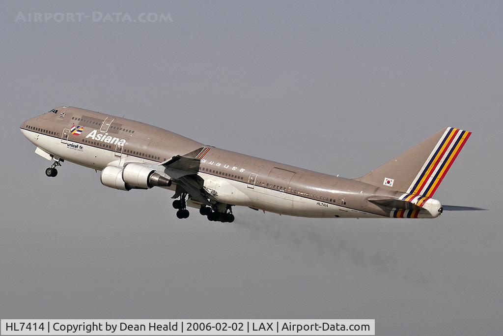 HL7414, 1991 Boeing 747-48EM(BDSF) C/N 25452, Departing 25R trailing brake dust on a hazy day.