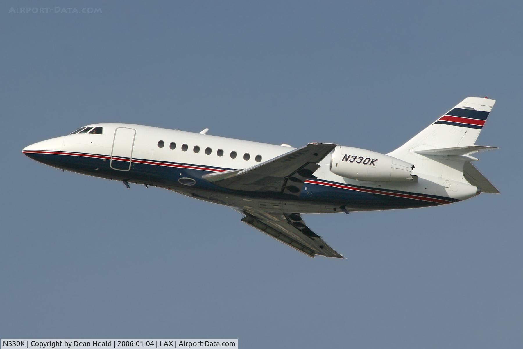 N330K, 2002 Dassault Falcon 2000 C/N 189, Departing LAX South Complex on a hazy day.