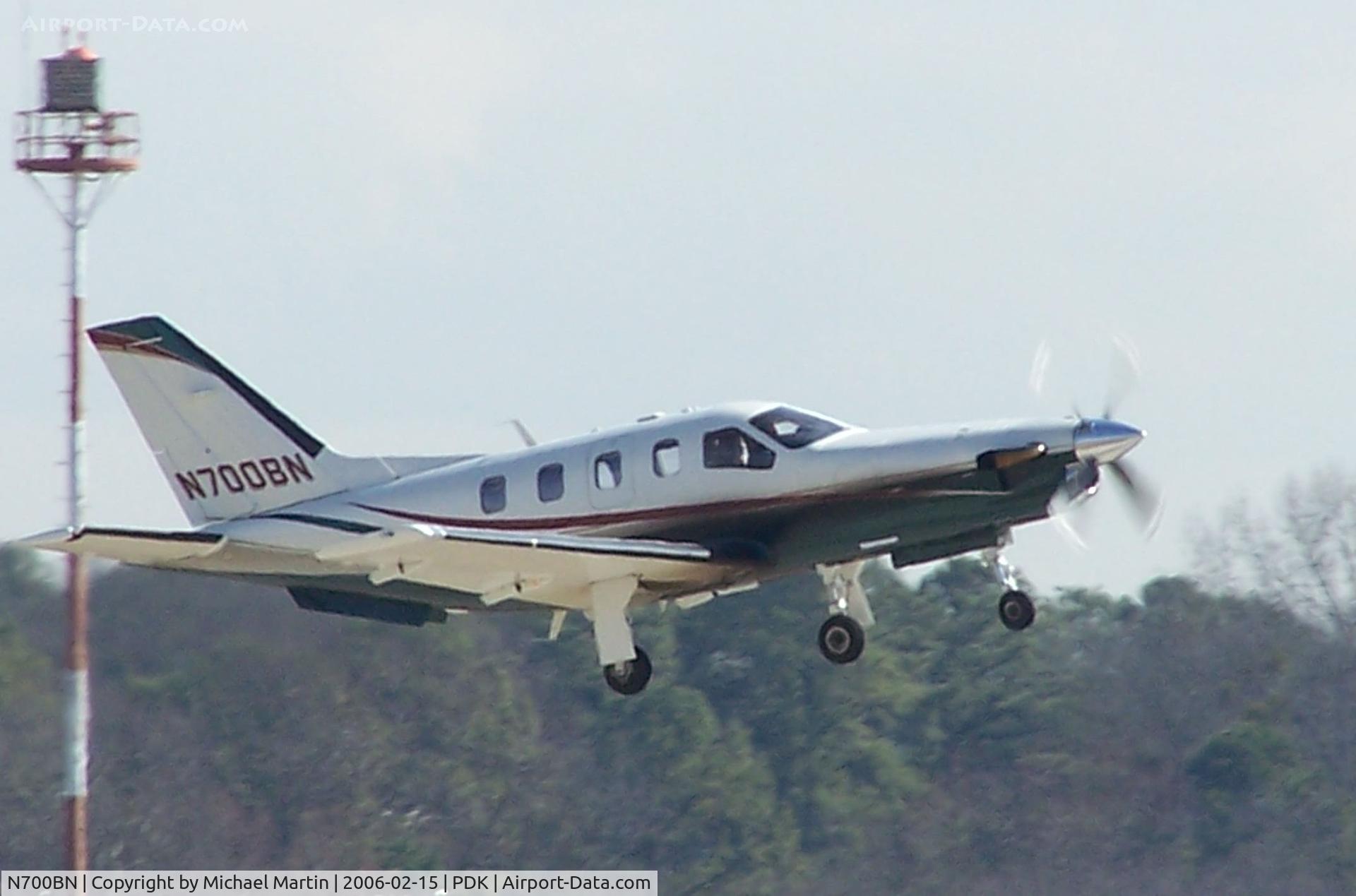 N700BN, 2001 Socata TBM-700 C/N 203, Departing PDK - Starting to rotate gear.