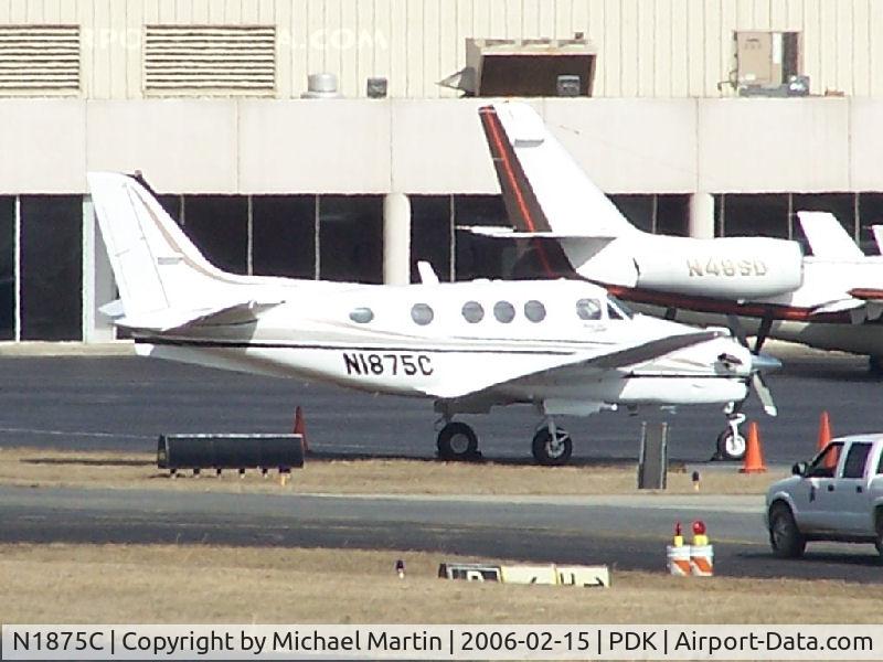 N1875C, 2001 Raytheon C90A King Air C/N LJ-1626, Tied down @ Signature Flight Services (Long range photo - pardon image)
