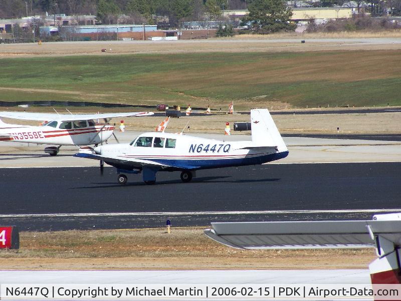 N6447Q, 1967 Mooney M20F Executive C/N 670526, Taxing past on going construction