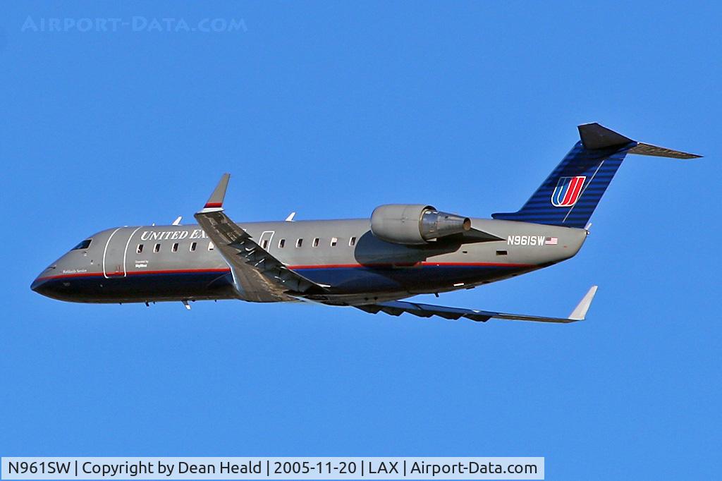 N961SW, 2003 Canadair CL-600-2B19 Regional Jet CRJ-200LR C/N 7857, N961SW departing RWY 25R early in the morning on a clear November day.