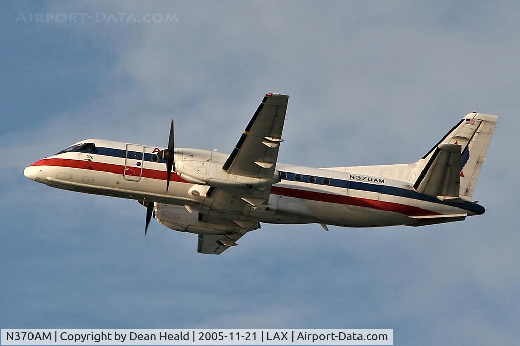 N370AM, Saab 340B C/N 340B-370, American Eagle Saab 340 (N370AM) climbing out from RWY 25R in the late afternoon.