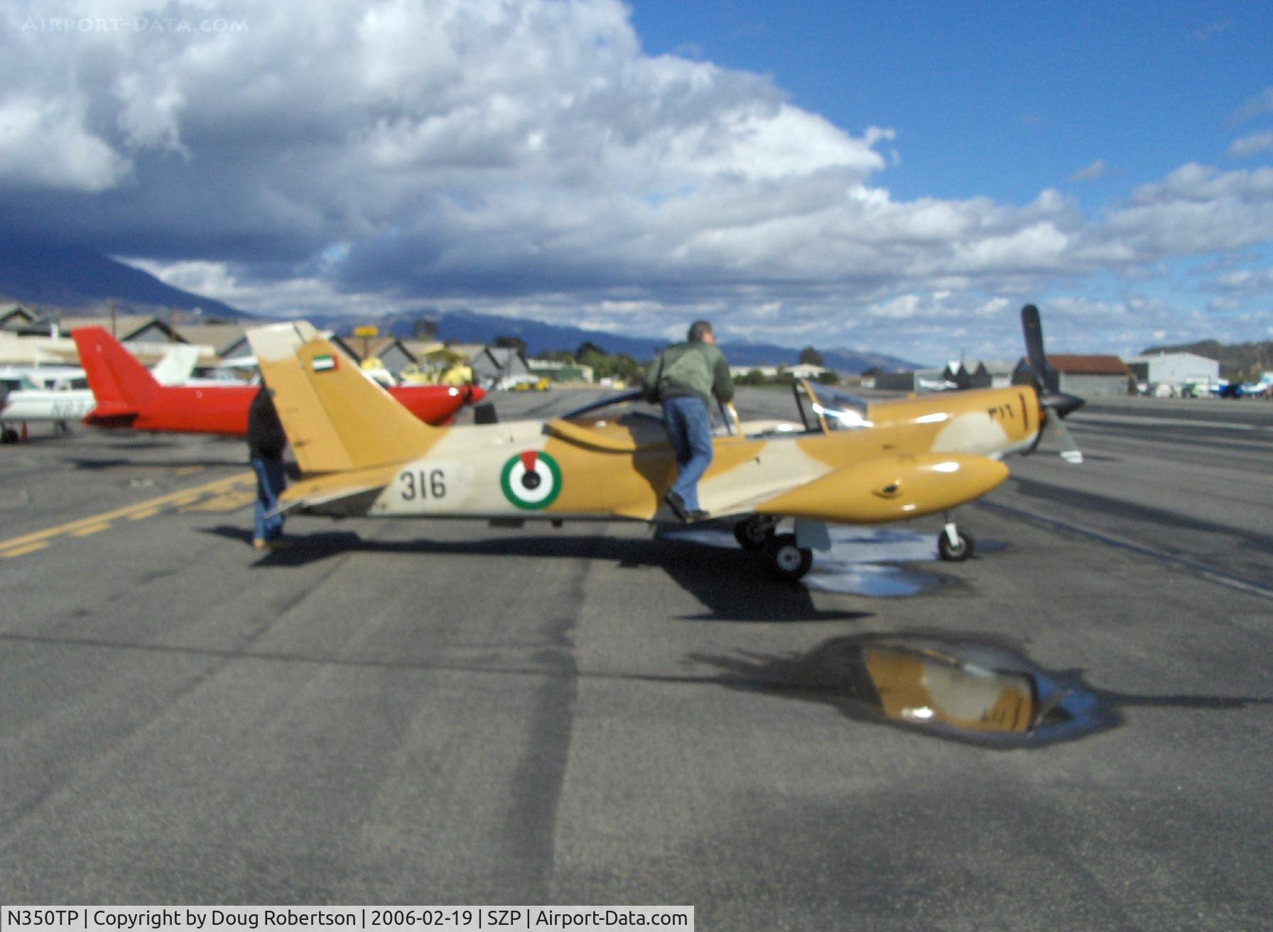 N350TP, 1983 SIAI-Marchetti SF-260TP C/N 011/62-004, 1983 Siai-Marchetti SF.260TP, Allison 250-B17 Turboprop 385 shp, UAE flagged, desert camouflage. Red N688C SF.260C experimental class behind