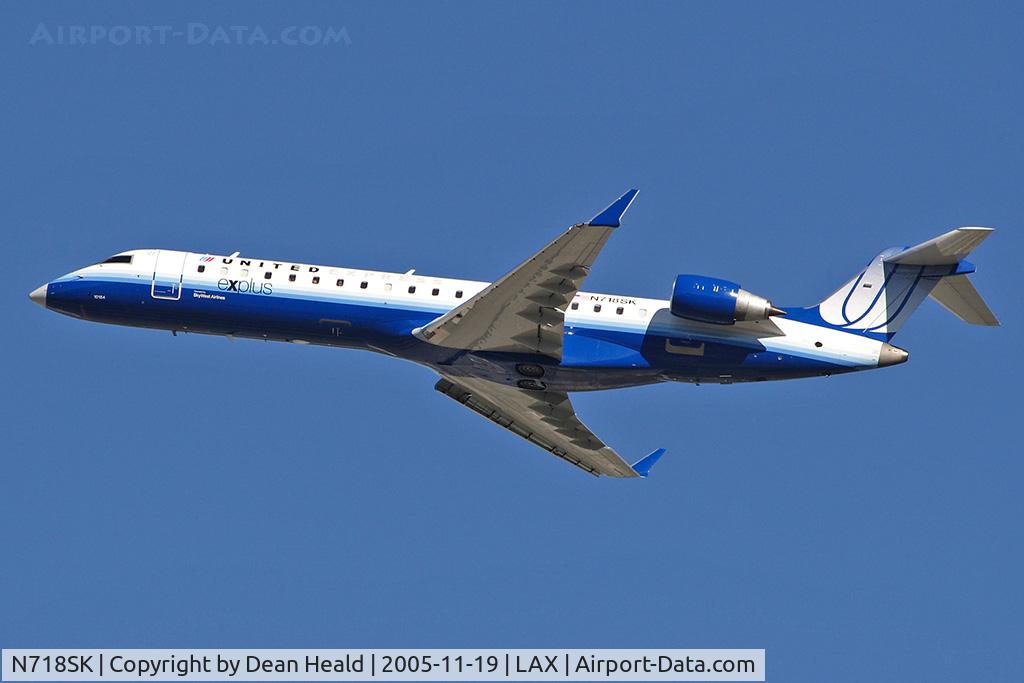 N718SK, 2004 Bombardier CRJ-701 (CL-600-2C10) Regional Jet C/N 10184, N718SK explus departing RWY 25R on a clear November day.  I'm partial to the CRJ-700 since I was involved in the wind tunnel testing of this aircraft.