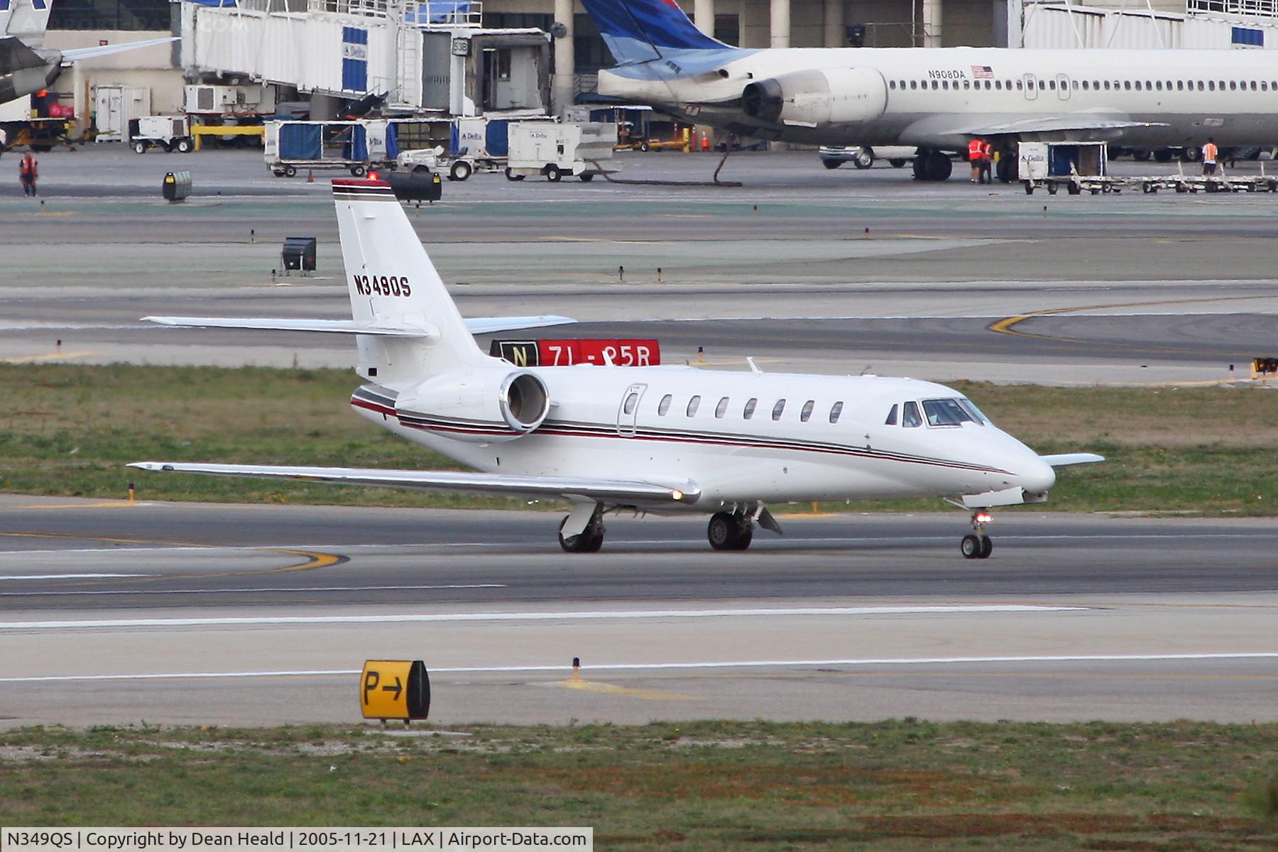 N349QS, 2005 Cessna 680 Citation Sovereign C/N 680-0029, Taxiing across RWY 25L.